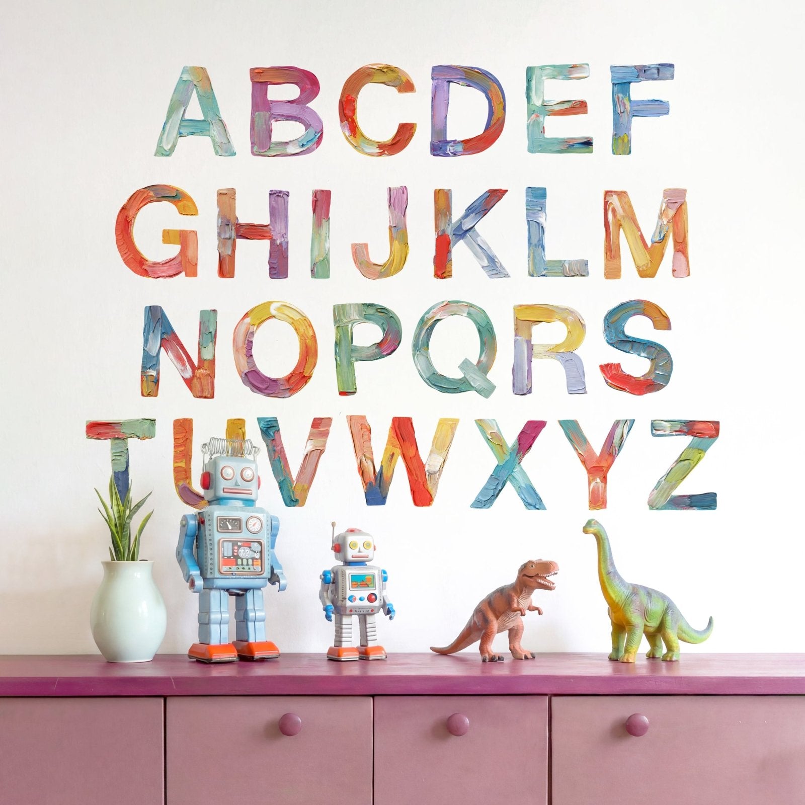 Full small alphabet wall decals styled across dresser wall with colorful kids room decor