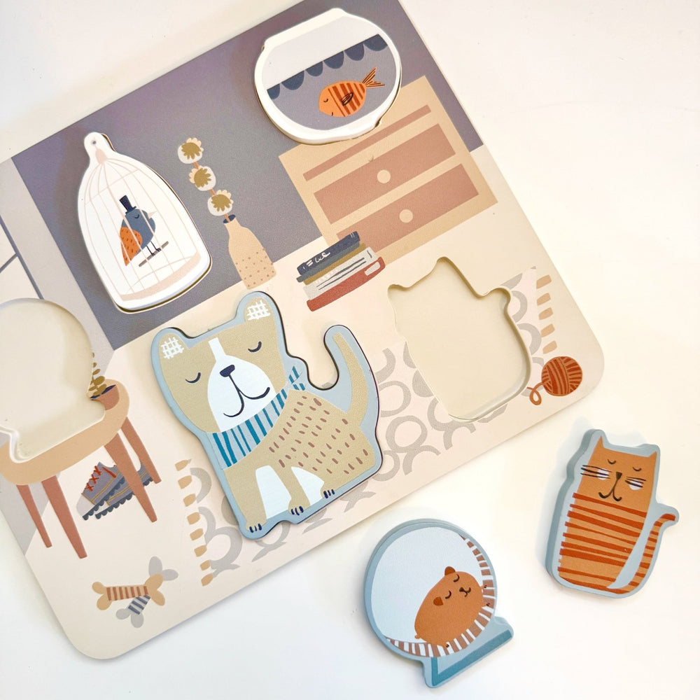 Set of cute animal-shaped puzzle pieces placed next to child's wooden puzzle.