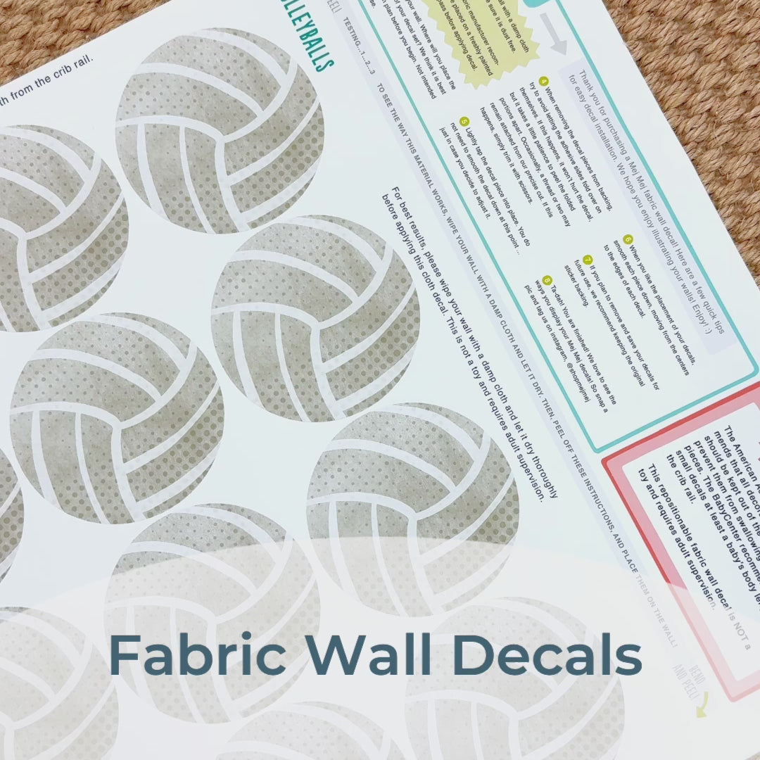 Load and play video in Gallery viewer, Step-by-step guide of how to install Mej Mej’s peel-and-stick removable fabric wall decals featuring watercolor volleyballs. Perfect for sports-themed decor for volleyball fans.
