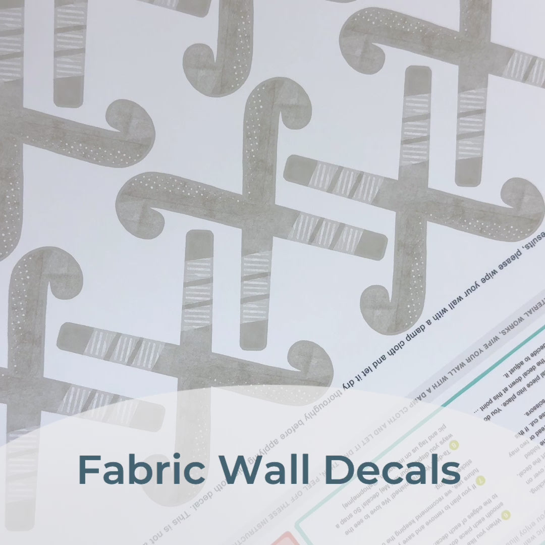 Step-by-step guide of how to install Mej Mej’s peel-and-stick removable fabric wall decals featuring watercolor field hockey sticks. Perfect for sports-themed decor for field hockey fans.