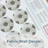 Step-by-step guide of how to install Mej Mej’s peel-and-stick removable fabric wall decals featuring watercolor soccer balls. Perfect for sports-themed decor for soccer fans.