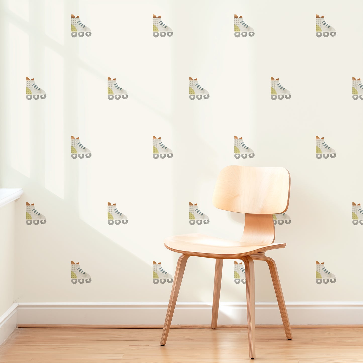 A wall is decorated with removable fabric wall decals of rollerblades by Mej Mej. They are placed in a modern grid pattern. A mid-century chair sits in front of them for scale.